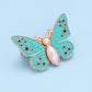 Bouton en forme de papillon qui s'adapte parfaitement