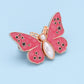 Bouton en forme de papillon qui s'adapte parfaitement